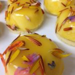 Cheesecake with apricot glaze & flower confetti.